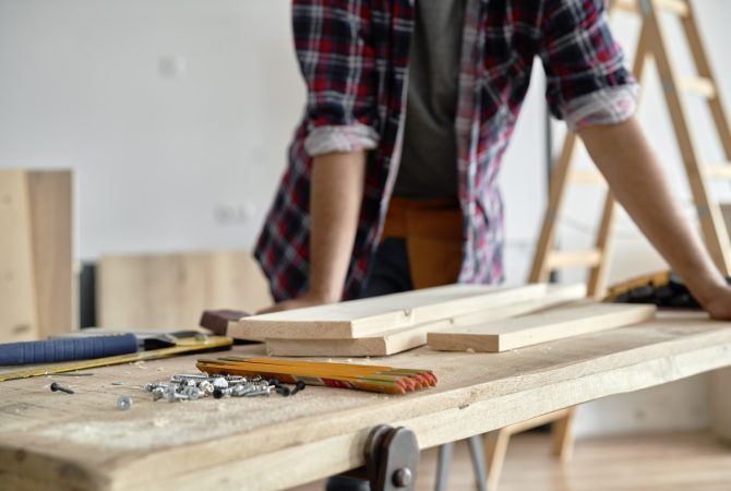 carpenter-standing-at-the-workbench